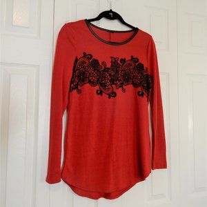 Red sweater with black embroidery